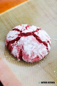 a red velvet cookie sitting on top of a table