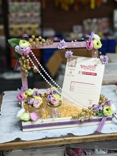 the table is decorated with flowers and pearls