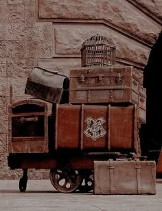 several pieces of luggage sitting on top of a cart