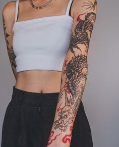 a woman with tattoos on her arm and arms