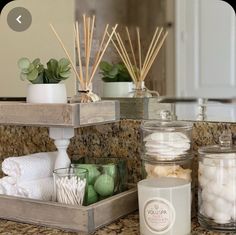 the bathroom counter is clean and ready to be used as a candle holder, soap dispenser, and other items