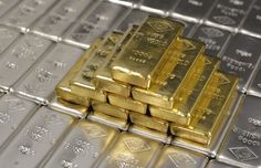 gold bars are stacked on top of each other