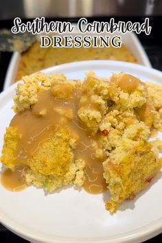 a close up of a plate of food with gravy on it and the words southern cornbread dressing