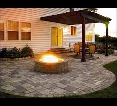 a fire pit sitting on top of a stone patio