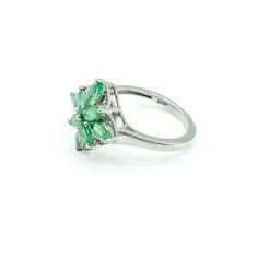 Sterling Silver Emerald Floral Ring Size 5. This Platinum plated Sterling Silver ring features eight marquise cut green Emerald stones prong set in a floral pattern. This makes a great birthday gift for a young lady. Emeralds symbolize love and truth and they are also the May Birthstone. Green is the color of life. It is often associated with nature, health, growth and prosperity. It represents hope for the future.Ring is pre-owned and in great condition. Buy with confidence knowing that all our Fine Jewelry Flower Ring With May Birthstone, Classic Green Cluster Ring As A Gift, Classic Green Cluster Ring For Gift, Classic Green Cluster Ring Gift, Classic Green Cluster Ring As Gift, Cluster Ring With Marquise Cut As Gift, Green Flower Ring For Promise, Green Flower Ring For Anniversary, Green Classic Cluster Ring Gift