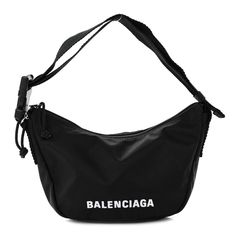 This is an authentic BALENCIAGA Recycled Sport Nylon Logo Embroidered Wheel Sling Bag in Black and White. The bag is crafted of black recycled nylon fabric with a white Balenciaga logo embroidered on the front. The bag features an adjustable shoulder strap with a black buckle at one end and silver hardware. The double top zippers open to a black nylon fabric interior with a zipper pocket. White Balenciaga, Sling Bag Black, Balenciaga Logo, Nylon Fabric, Black Nylon, Black Nylons, Logo Embroidered, Silver Hardware, Sling Bag