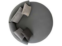 a round table with four pillows on it