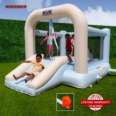 an inflatable bounce house with two children on it