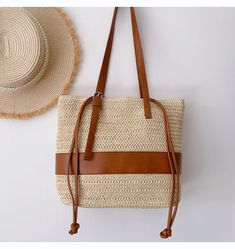 In Stock Fast Shipping! Medium sized straw woven tote bag with leather trims perfect for all occasions. PU leather strap Drawstring closure Inside pocket Size approximately 13.7"W X 10.2"H X 4.5"D 11.8'' handle drop Designer Style ID: 8351 Straw Woven Tote Bag with Leather Straps, Summer Bag, Everyday Shoulder Bag, Beach Bag Summer Beige Shoulder Bag With Leather Handles, Rectangular Beige Bucket Bag With Leather Handles, Beige Rectangular Bucket Bag With Leather Handles, Casual Natural Bag With Woven Leather Details, Casual Natural Bag With Woven Leather, Chic Beige Beach Bag With Leather Handles, Chic Braided Bucket Bag For Travel, Casual Natural Shoulder Bag With Leather Handles, Casual Natural Woven Leather Bag