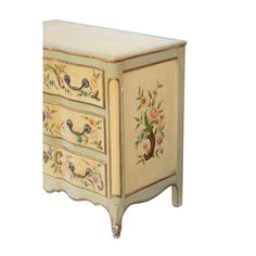 an ornate painted chest of drawers with birds and flowers on the front, side view