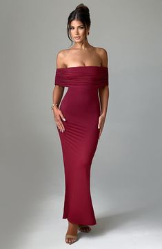 Whether it's date night or girls night, capture all attention in the Belinda maxi dress. Made in super smooth, slinky fabric that moulds to your body, this double layered design features an off the shoulder, bardot neckline that's gathered. It's complete with an open low back with ruched detailing. Looks amazing paired with tonal heels and gold jewellery. 



Colour: Burgundy.

Stretch double layered slinky fabric.

Fully lined.

Gathered, bardot neckline.

Hugs the figure.

Super sculpted fit. Burgundy Maxi Dress, Backless Evening Dress, Bardot Neckline, Maxi Dress Sale, Solid Color Dress, Maxi Robes, High Quality Dress, Bodycon Dress Parties, German Language