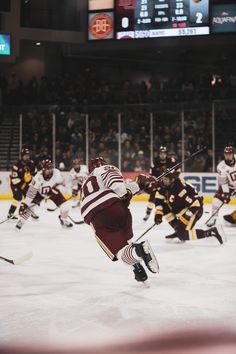 the hockey players are playing on the ice