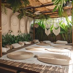 a room with lots of plants and plates on the floor