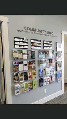 the front wall of a community information center with many cards and folders on it