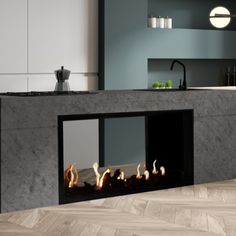 a modern fireplace in the middle of a kitchen