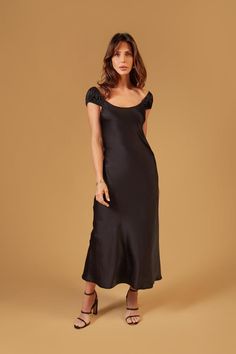 A stunning and elegant fashion piece that combines the luxurious allure of satin with a sophisticated midi-length design and delicate cap sleeves. Cap Sleeve Satin Dress, Satin Cap Sleeve Dress, Black Satin Wedding Guest Dress, Satin Cowl Neck Dress With Sleeves, Black Occasion Dress, Holiday Midi Dress, Classy Cocktail Outfits, Wedding Welcome Party Outfit, Rehearsal Dinner Dress For Guest