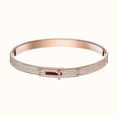 Add some sparkle to your wrist with the Kelly Bracelet, featuring paved diamonds for a touch of luxury. This bracelet will elevate any outfit, making you feel like a true fashionista. Shine bright like a diamond with the Kelly Bracelet. ADDITIONAL INFORMATION Color: Silver, Pink Gold Stone: Cubic Zirconia Ref. od914114 Material:- 925 Sterling Silver - 18k Gold Plated Length:17, 19 Our replica products are committed to quality and color when used. They are made 99% similar to the original. After Kelly Bracelet, Bracelet With Diamonds, Hermes Jewelry, Bracelet Diamond, Iconic Bags, Diamond Bracelets, Gold Set, Pink Gold, Pave Diamonds