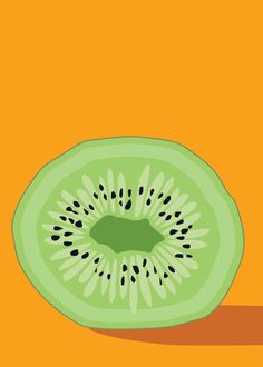 a kiwi cut in half on an orange background