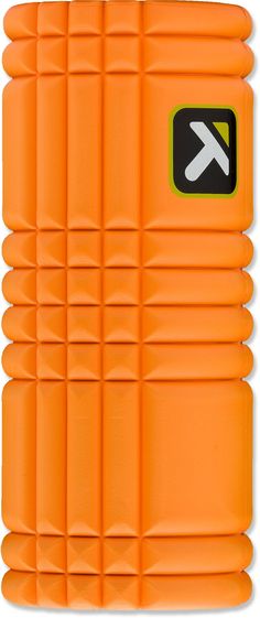 an orange foam yoga mat with the letter k on it's side and a white background