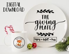 the giving plate is next to a mug and candy canes