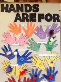 there is a sign that says hands are for children with handprints on it