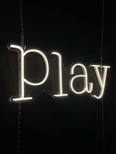 a neon sign that says play on it