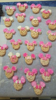 mickey and minnie mouse cookies are on a cookie sheet, ready to be baked into the oven