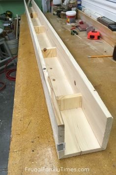 a long piece of wood sitting on top of a table