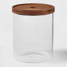 a glass jar with a wooden lid