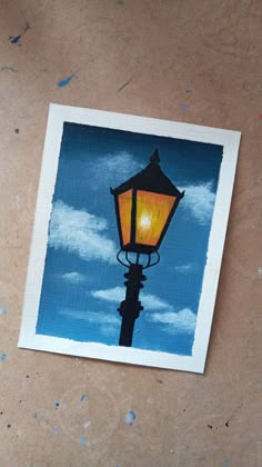 a painting of a street light on a piece of paper