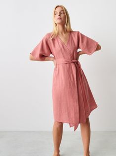 "MARY is a short sleeve, robe style linen wrap dress with a self tie belt. DETAILS - Self tie belt with no closure or belt loops - Dolman style sleeves - Knee length - 100% lightweight European linen fabric - Cut and sewn to order just for you in our studio COLOR - Salmon Pink, you can also choose other colors above - Fabric samples are available here https://www.etsy.com/listing/586569696/linen-fabric-samples SIZING & FIT - Relaxed fit - True to size - Model is 5'8\" / 173cm and wearing a size S CARE FOR LINEN - Machine wash up to 30ºC/86ºF gentle cycle - Lay flat to dry or tumble dry low - Warm iron if needed - Do not bleach SIZE GUIDE Size conversion guide Size XS (US 0-2, IT 36-38, UK 4-6, Japan 3-5, France 32-34) Size S (US 4-6, IT 40-42, UK 8-10, Japan 7-9, France 36-38) Size M (US 8 Short Sleeve Wrap Dress For Daywear, Casual Linen Wrap Dress With Tie Waist, Belted Short Sleeve Wrap Dress For Beach, Belted Wrap Dress With Short Sleeves For Beach, Short Sleeve Belted Wrap Dress For Beach, Belted Wrap Dress For Daywear, Beach Wrap Linen Dress With Tie Waist, Linen Wrap Dress With Belt, Short Sleeve Linen Dress With Tie Waist