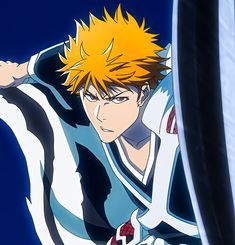 an anime character with yellow hair and blue eyes, holding his arms behind his back