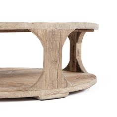 a wooden table that is made out of wood and has curved edges on the top