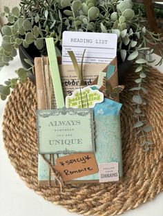 a basket with some books and plants in it