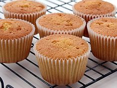 six cupcakes sitting on a cooling rack