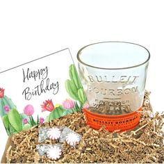 a thank you card and glass in a box