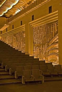 an empty auditorium with rows of seats