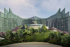 an artistic rendering of a futuristic building surrounded by greenery