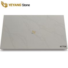 an image of a white marble counter top with gold lettering on the front and bottom