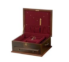 an open wooden box with jewelry in it