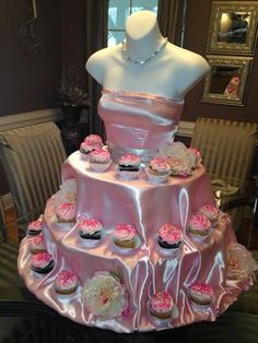 a dress made out of cupcakes on top of a table