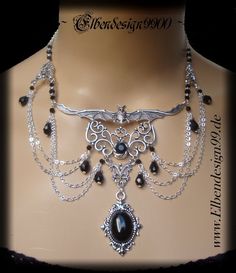 A very elegant choker in gothic style, which, like all my jewelry, was made with great care and attention to detail. The necklace was made from silver-plated metal ornaments with black faceted glass beads and black glass stones. Black diamond rhinestones were also used. The chain is adjustable from approx. 39 cm-46 cm, with a black drop hanging on the extension chain. Silver Vampire Style Necklace, Silver Vampire Choker For Halloween, Fantasy Halloween Choker Necklace, Silver Vampire Style Choker Necklace, Witchy Silver Jewelry For Parties, Silver Witchy Choker Jewelry, Gothic Silver Necklaces For Festival, Gothic Metal Necklace, Silver Vampire Style Metal Jewelry