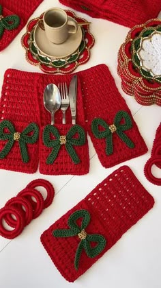 crocheted christmas placemats, napkins and cups on a white table