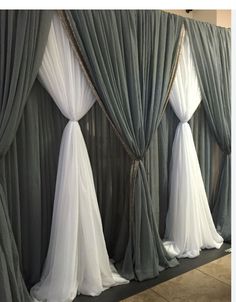 the curtains are lined up against the wall