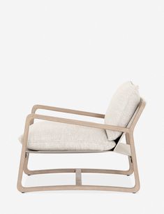 a white chair with a beige cushion on it's back and armrests