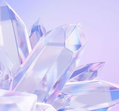 some very pretty shiny looking crystals on a purple and blue background with the sky in the background