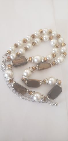 This is for a vintage, faux pearl, tiger eye beaded necklace. This is in good condition, and has not been cleaned or altered. This has usual wear and tear for the age, and has a nice weight. The pictures don't always depict the true color and this is unsigned. I took several pictures so you could see clearly the condition they are in. This is a used item and sold as is. If you have any questions, please contact me. I sell an item as is, so normally don't refund. This item has free shipping. Multi-strand Pearl Necklace With Gemstone Beads, Vintage Multi-strand Beaded Necklace With Polished Beads, Vintage Multi-strand Necklace With Large Beads, Vintage Beaded Multi-strand Pearl Necklace, Vintage Brown Multi-strand Beaded Necklaces, Tiger Eye Beads, Bead Jewelry, The Age, Strand Necklace