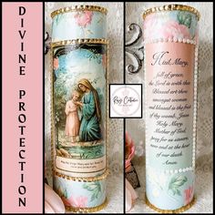 a candle with an image of the virgin mary and jesus on it, next to a prayer card