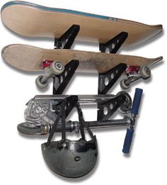 two skateboards are attached to the back of each other with wheels and chains on them