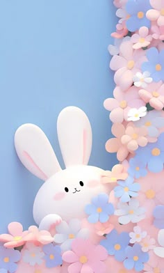 a white bunny sitting in the middle of some pink and blue flowers on a light blue background